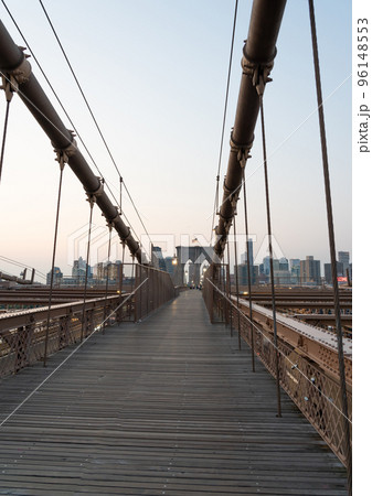 Classic view of the pedestrian part of the Brooklyn Bridge in the early morning Classic view of the pedestrian part of the Brooklyn Bridge in the early morning 96148553