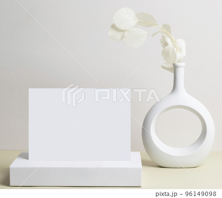 greeting card front view and dry flower in vase ceramic on table 96149098