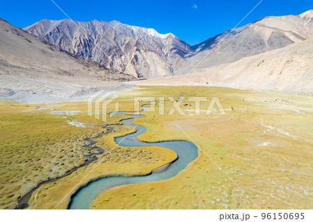 Landscape aerial view of mountains with river and green valley in Himalayas with blue sky in Nubra valley, Jammu and Kashmir, India.  96150695