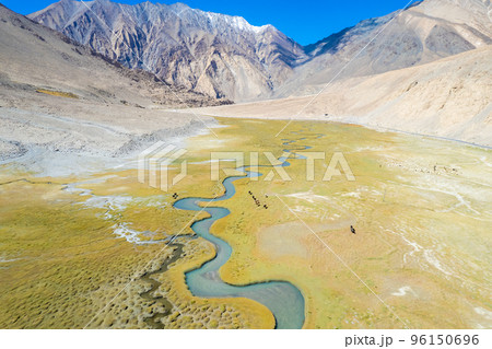 Landscape aerial view of mountains with river and green valley in Himalayas with blue sky in Nubra valley, Jammu and Kashmir, India.  96150696