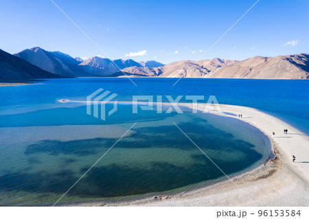 Aerial landscape of Pangong Lake and mountains with clear blue sky, it's a highest saline water lake in Himalayas range, landmarks and popular for tourist attractions in Leh, Ladakh, India, Asia Aerial landscape of Pangong Lake and mountains with clear blue sky, it's a highest saline water lake in Himalayas range, landmarks and popular for tourist attractions in Leh, Ladakh, India, Asia 96153584