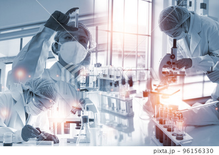 Double exposure microscope and Young woman scientific using equipment in the laboratory for research. Double exposure microscope and Young woman scientific using equipment in the laboratory for research. 96156330