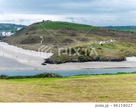 Picturesque hills in the south of Ireland, a view of the Clonakilty seashore. Cloudy, rainy weather. Landscapes along the Wild Atlantic Way. Nature of Europe. Beautiful places. 96158027
