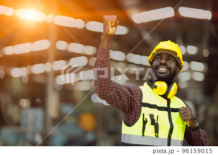 success black African male worker raised his fist in happy joyful. congratulate enjoy working and receive good welfare concept 96159015