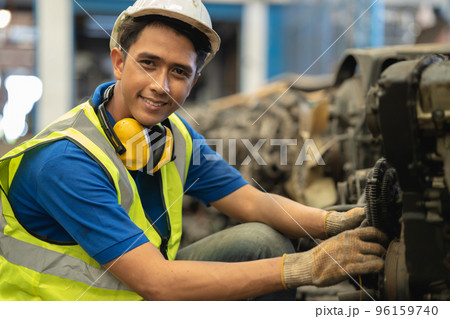 portrait young male worker engineer working in heavy industry with safety happy smile looking camera portrait young male worker engineer working in heavy industry with safety happy smile looking camera 96159740