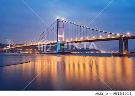 Suspension bridge to Park island at evening time. 96161511