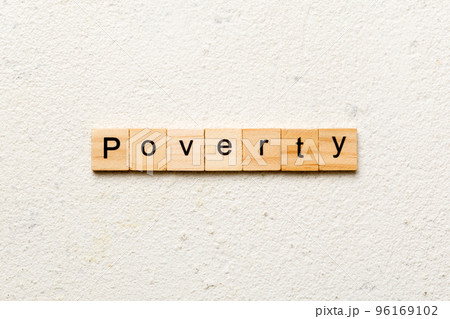 Poverty word written on wood block. Poverty text on cement table for your desing, concept 96169102