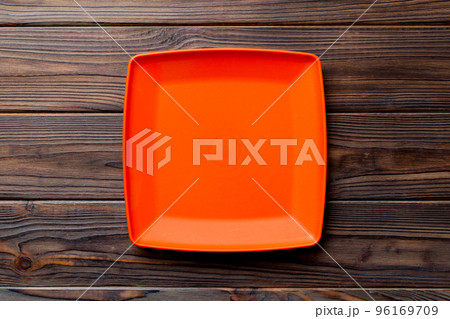 Top view of empty square plate on wooden background. Empty space for your design 96169709