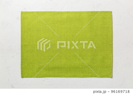 Top view of green tablecloth for food on cement background. Empty space for your design Top view of green tablecloth for food on cement background. Empty space for your design 96169718
