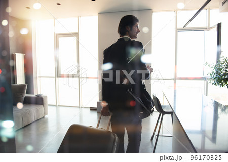 Businessman at the phone ready to travel. Businessman at the phone ready to travel. 96170325