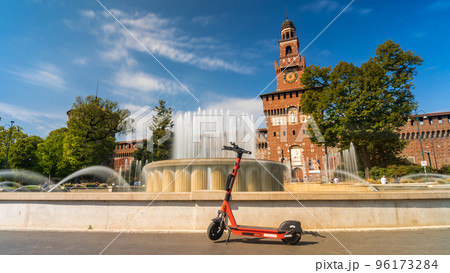 Electric scooter near Castello Sforzesco - Sforza Castle in Milan, Italy. 96173284