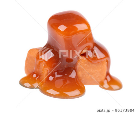 Sweet caramel candies and sauce, isolated on white background. Delicious caramel. Sweet caramel candies and sauce, isolated on white background. Delicious caramel. 96173984