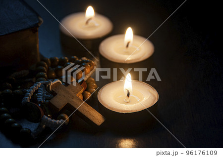 Holy Rosary, Bible and burning candles with customizable space for religious text or ideas. Copy space and religion concept 96176109