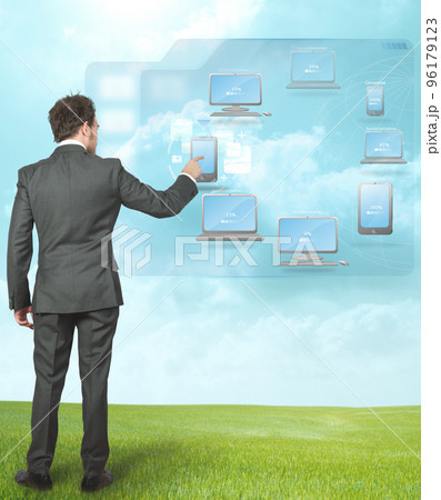 Businessman working with cloud compute Businessman working with cloud compute 96179123