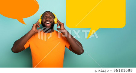 Boy with yellow headset listens to music and dances. emotional and energetic expression. vignette for your text 96181699