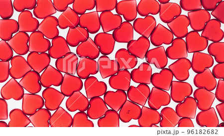 St Valentines day transparent red background full frame. Many glass hearts flat lay. Love or wedding cover concept St Valentines day transparent red background full frame. Many glass hearts flat lay. Love or wedding cover concept 96182682