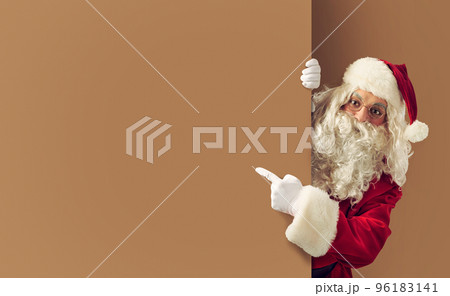 Santa claus indicates a blank space for your text 96183141