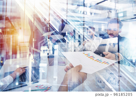 Team of people work together with statistics. concept of teamwork and partnership. Double exposure 96185205