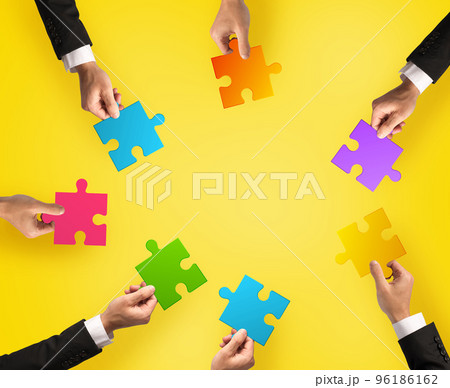 Teamwork and integration concept with puzzle pieces. 96186162