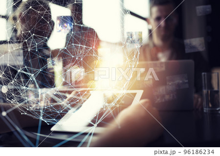 Businessman works in office with a tablet. Concept of internet sharing Businessman works in office with a tablet. Concept of internet sharing 96186234