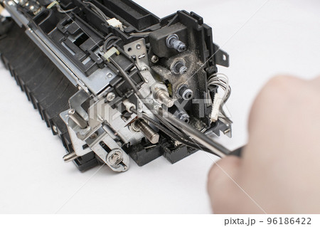 gearbox of a technical device node in which the master hand unscrews a bolt, screw, nut with a screwdriver gearbox of a technical device node in which the master hand unscrews a bolt, screw, nut with a screwdriver 96186422