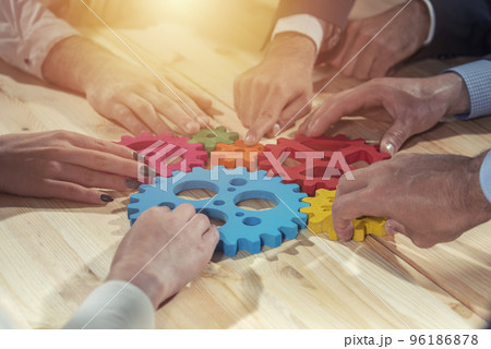 Business team connect pieces of gears. Teamwork, partnership and integration concept 96186878