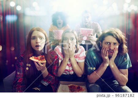 Group of friends watch a film at the cinema Group of friends watch a film at the cinema 96187182
