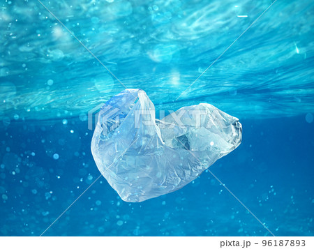 Floating bag. Problem of plastic pollution under the sea concept. 96187893