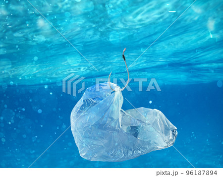Floating bag. Problem of plastic pollution under the sea concept. 96187894