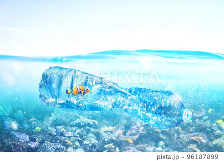 Fish trapped inside a bottle. Problem of plastic pollution under the sea concept. Fish trapped inside a bottle. Problem of plastic pollution under the sea concept. 96187899
