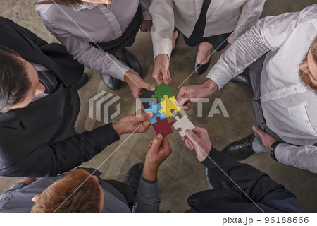 Teamwork of partners. Concept of integration and startup with puzzle pieces. Teamwork of partners. Concept of integration and startup with puzzle pieces. 96188666