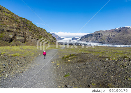 Vatnajokull is the largest and most voluminous ice cap glacier in Iceland. Visitors taking a short trail hikes to the edge of the glacier from visitor center 96190176