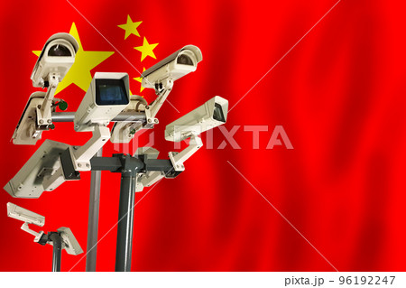 Chinese CCTV camera on the flag of China Surveillance, security, control and totalitarianism concept Chinese CCTV camera on the flag of China Surveillance, security, control and totalitarianism concept 96192247