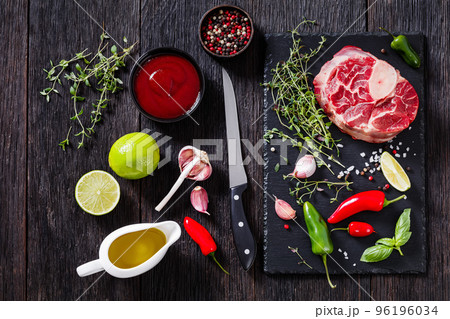 raw osso buco, veal shank steak on stone board 96196034