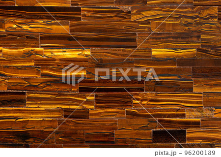 Tiger Eye Golden. Semi precious mineral pattern. Polished semiprecious stone for ceramic wall and floor digital tiles. Material for unique interior, exterior design. Luxury gemstone background. Tiger Eye Golden. Semi precious mineral pattern. Polished semiprecious stone for ceramic wall and floor digital tiles. Material for unique interior, exterior design. Luxury gemstone background. 96200189