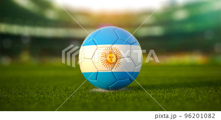 Football ball with flag of Argentina on the field of football stadium and space for name of football clubs. Football championship of Argentina concept. Football ball with flag of Argentina on the field of football stadium and space for name of football clubs. Football championship of Argentina concept. 96201082