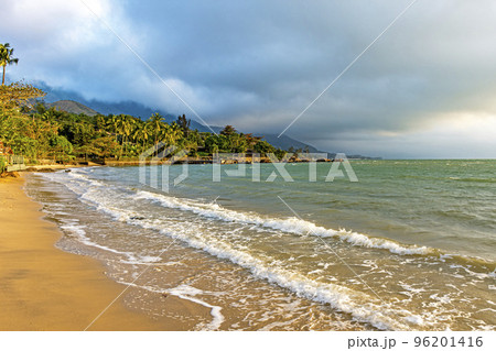 Sunset on one of the paradisiacal beaches on the island of Ilhabela Sunset on one of the paradisiacal beaches on the island of Ilhabela 96201416