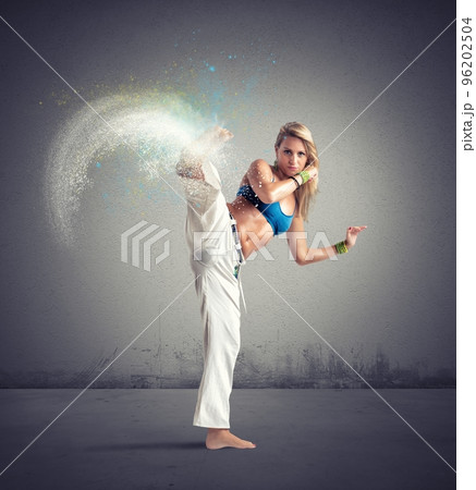 Woman playing capoeira Woman playing capoeira 96202504