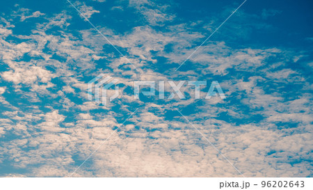 White clouds on a blue sky. Feather clouds in the sky, cloud background 96202643