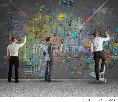 Business team drawing a new project Business team drawing a new project 96203003