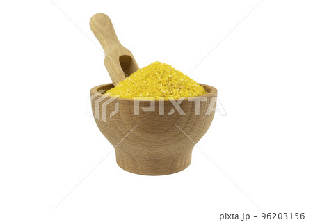 corn grits in wooden bowl and scoop isolated on white background. nutrition. food ingredient. corn grits in wooden bowl and scoop isolated on white background. nutrition. food ingredient. 96203156