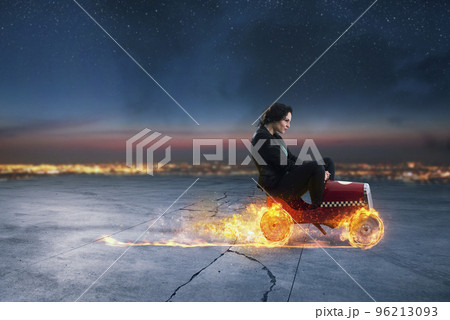 Fast businesswoman with a car wins against the competitors. Concept of success and competition Fast businesswoman with a car wins against the competitors. Concept of success and competition 96213093