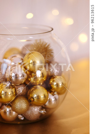 Close-up of golden glittery decorative Christmas glitters inside transparent glass jar Close-up of golden glittery decorative Christmas glitters inside transparent glass jar 96213615