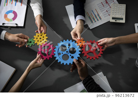 Business team connect pieces of gears. Teamwork, partnership and integration concept 96213672