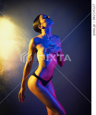 Sexy model with colored lights effect Sexy model with colored lights effect 96214127