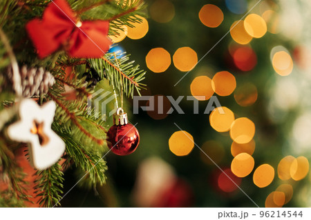 Close-up of spruce branches, toys, balls on the fireplace. Christmas decorations, Christmas background 96214544