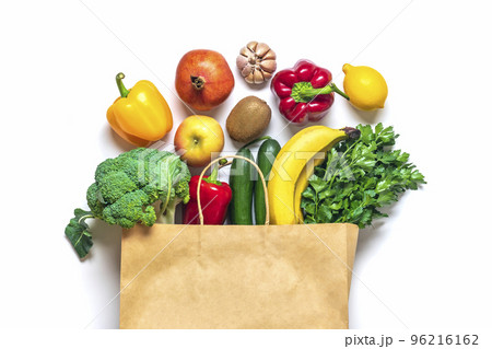 Eco friendly paper shop bag with raw organic green vegetables isolated on white background Flat lay, top view Zero waste, plastic free concept Healthy clean eating diet and detox, agriculture concept. Eco friendly paper shop bag with raw organic green vegetables isolated on white background Flat lay, top view Zero waste, plastic free concept Healthy clean eating diet and detox, agriculture concept. 96216162