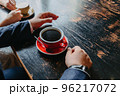Couple drinking coffee at cafe restaurant man and woman 96217072