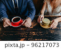 Couple drinking coffee at cafe restaurant man and woman 96217073