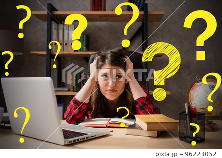 Woman works at home as smart working and has a lot of questions Woman works at home as smart working and has a lot of questions 96223052